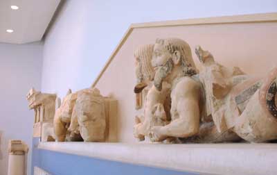 Parts of a frieze with reclining figures.