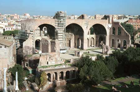 Forum Romano. There are little tiny people in front of the large archways.