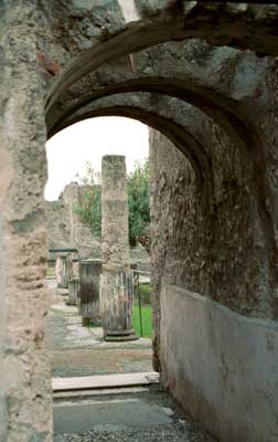 Archway with stone patchwork floor.