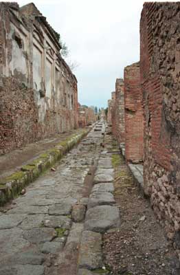 A medium sized street with sidewalks.