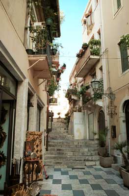 This narrow street goes uphill by steps.