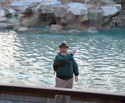 Dave tossing a coin into Trevi Fountain.