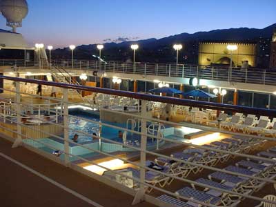 Lido deck at night in port.